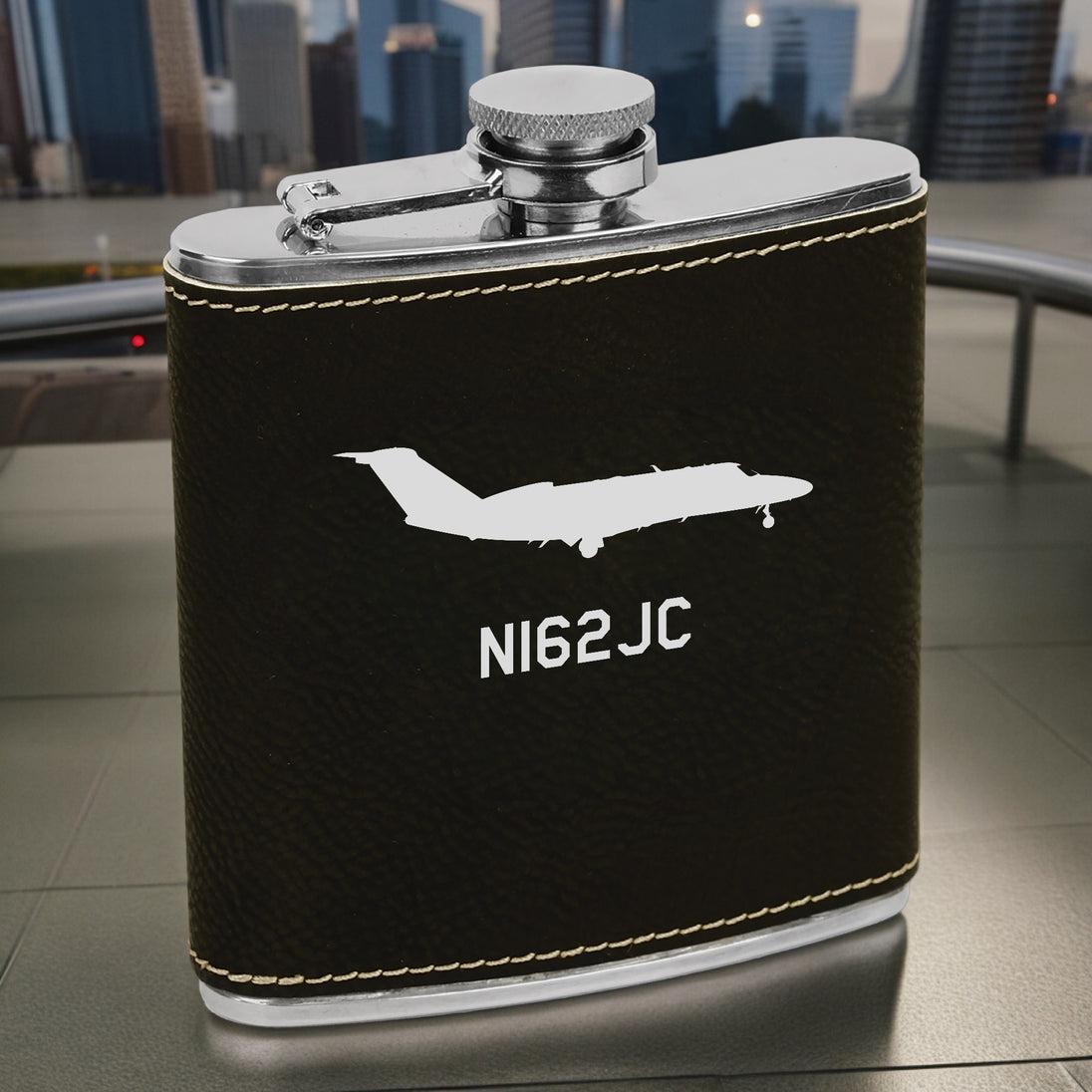 a flask with a picture of a plane on it