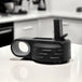 a black and white photo of a device on a counter