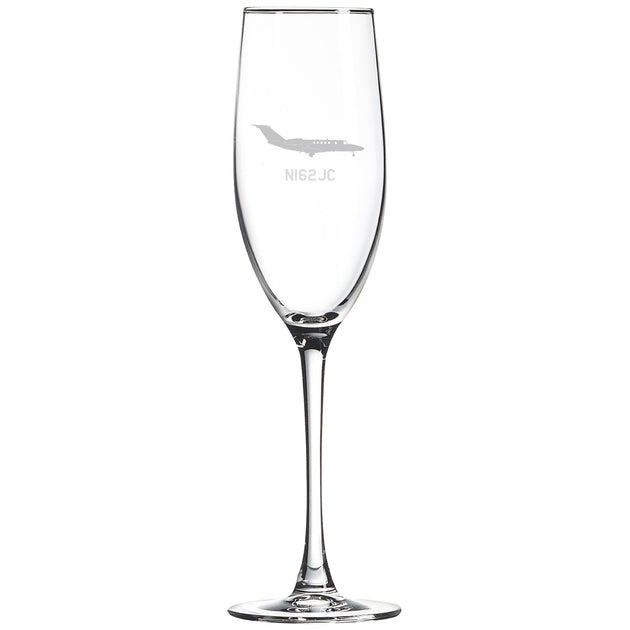 a wine glass with a bird etched on it