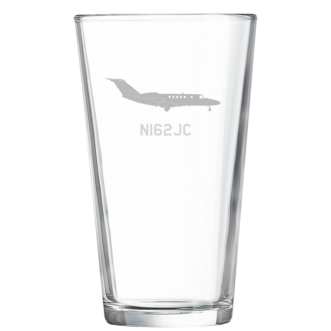 a glass with a plane etched on it