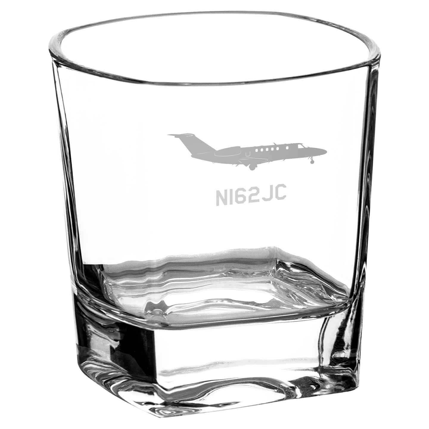 a glass with a plane etched on it