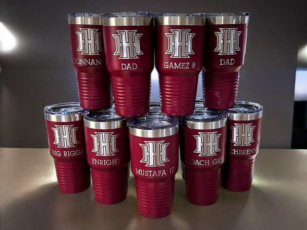 a stack of red tumblers sitting on top of a table